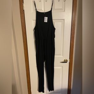 NWT Black Romper with tags. Size Large.